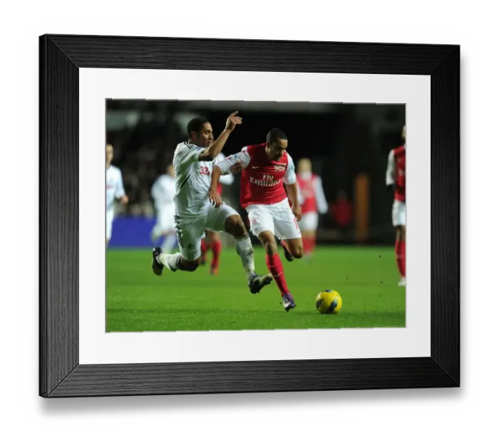 Framed Print : Theo Walcott vs Ashley Williams: A Football Rivalry Erupts at Swansea City (2011-12) Framed Print : Theo Walcott vs Ashley Williams: A Football Rivalry Erupts at Swansea City (2011-12)
