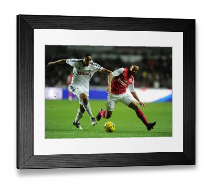 Framed Print : Theo Walcott vs Ashley Williams: A Football Rivalry Erupts at Swansea City (2011-12)