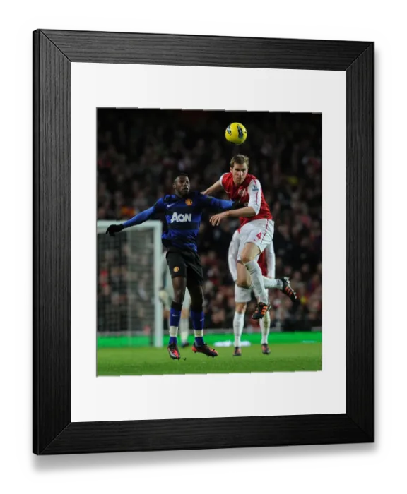 Framed Print : Arsenal vs Manchester United: Intense Moment Between Per Mertesacker and Danny Welbeck Framed Print : Arsenal vs Manchester United: Intense Moment Between Per Mertesacker and Danny Welbeck