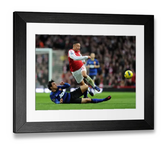 Framed Print : Oxlade-Chamberlain vs Rafael: Battle in the Arsenal vs Manchester United Premier League Clash (2012) Framed Print : Oxlade-Chamberlain vs Rafael: Battle in the Arsenal vs Manchester United Premier League Clash (2012)