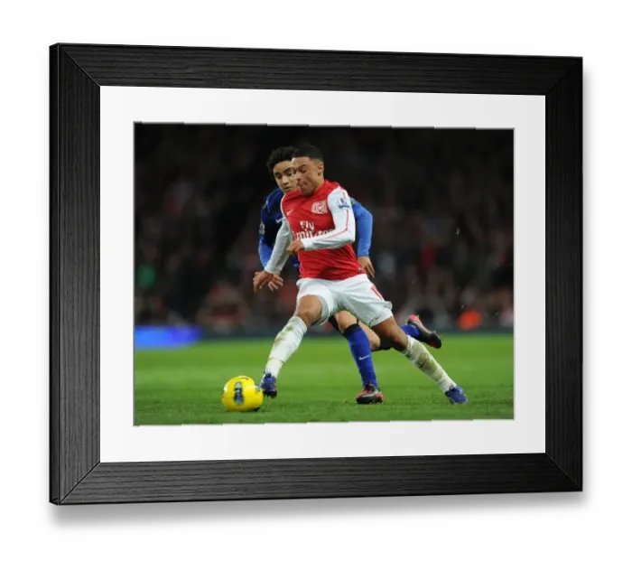 Framed Print : Alex Oxlade-Chamberlain (Arsenal) Rafael (Man Utd). Arsenal 1: 2 Manchester United Framed Print : Alex Oxlade-Chamberlain (Arsenal) Rafael (Man Utd). Arsenal 1: 2 Manchester United