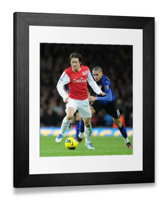 Framed Print : Arsenal's Rosicky Outmaneuvers Manchester United's Smalling in Premier League Clash