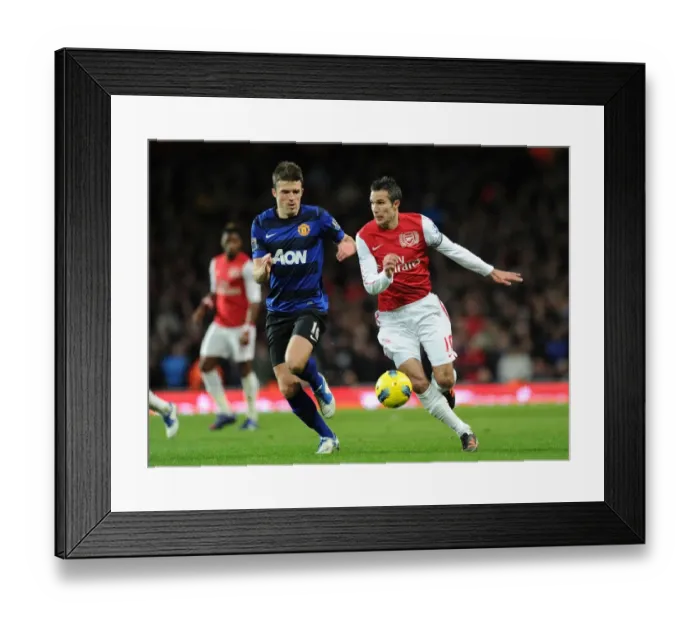 Framed Print : Arsenal vs Manchester United: A Battle Between Robin van Persie and Michael Carrick Framed Print : Arsenal vs Manchester United: A Battle Between Robin van Persie and Michael Carrick