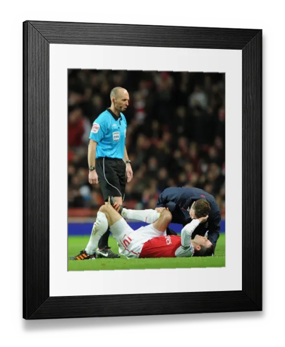 Framed Print : Arsenal's Robin van Persie Receives Treatment vs Manchester United (2011-12)