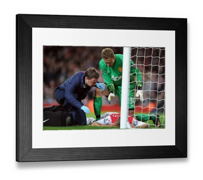 Framed Print : Theo Walcott Receives Treatment from Colin Lewin as Anders Lindegaard Looks On: Arsenal v Manchester United, Premier League 2011-12