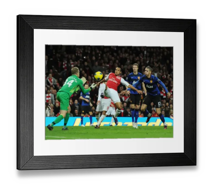 Framed Print : Theo Walcott vs. Anders Lindegaard: Intense Battle at the Emirates - Arsenal vs. Manchester United, Premier League 2011-12 Framed Print : Theo Walcott vs. Anders Lindegaard: Intense Battle at the Emirates - Arsenal vs. Manchester United, Premier League 2011-12