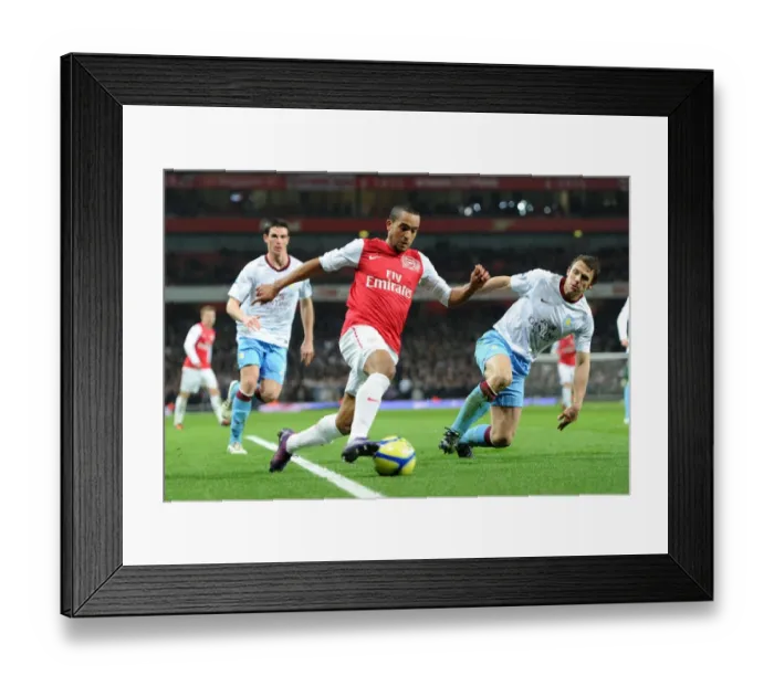Framed Print : Theo Walcott vs. Stephen Warnock: A Battle in the FA Cup Fourth Round between Arsenal and Aston Villa Framed Print : Theo Walcott vs. Stephen Warnock: A Battle in the FA Cup Fourth Round between Arsenal and Aston Villa