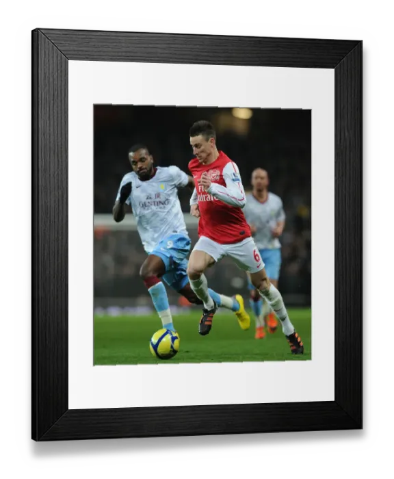 Framed Print : Arsenal's Koscielny Overpowers Aston Villa's Bent in FA Cup Clash