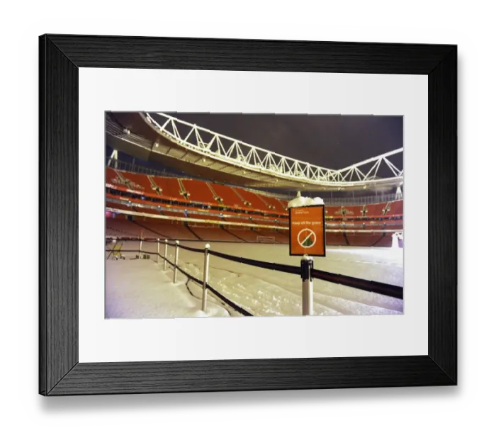 Framed Print : Winter's Battle at Emirates: Arsenal vs. Blackburn Rovers in a Snow-Covered Premier League