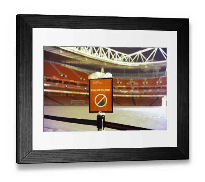 Framed Print : Winter's Grip: Arsenal's Emirates Stadium Blanketed in Snow