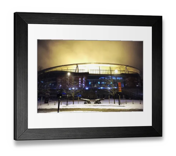 Framed Print : Arsenal's Winter Battlefield: Snowy Emirates Stadium in the Premier League Framed Print : Arsenal's Winter Battlefield: Snowy Emirates Stadium in the Premier League