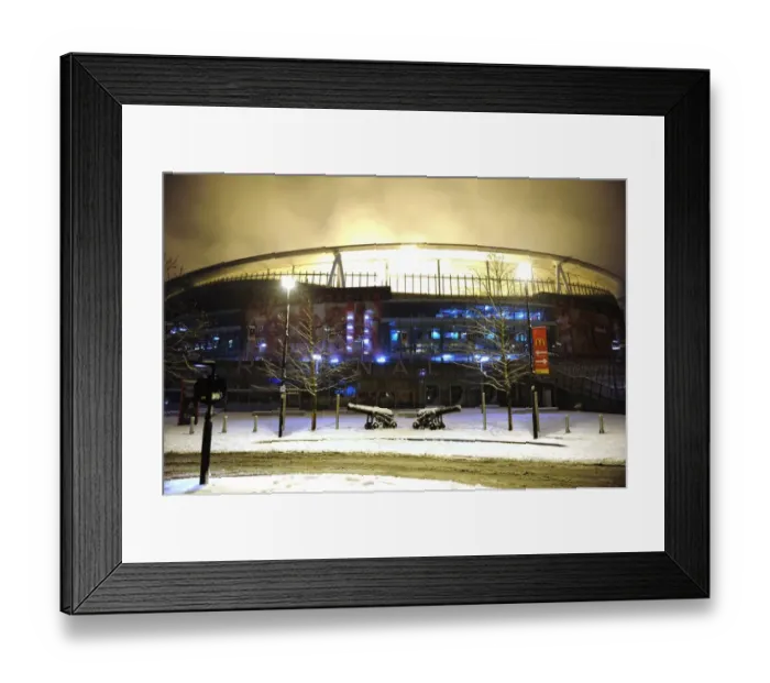 Framed Print : Winter's Battle at Emirates: Arsenal vs. Blackburn Rovers in a Snow-Covered Premier League