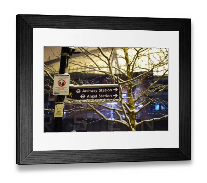 Framed Print : Winter's Battle at Emirates: Arsenal vs. Blackburn Rovers in a Snowy London Premier League Showdown