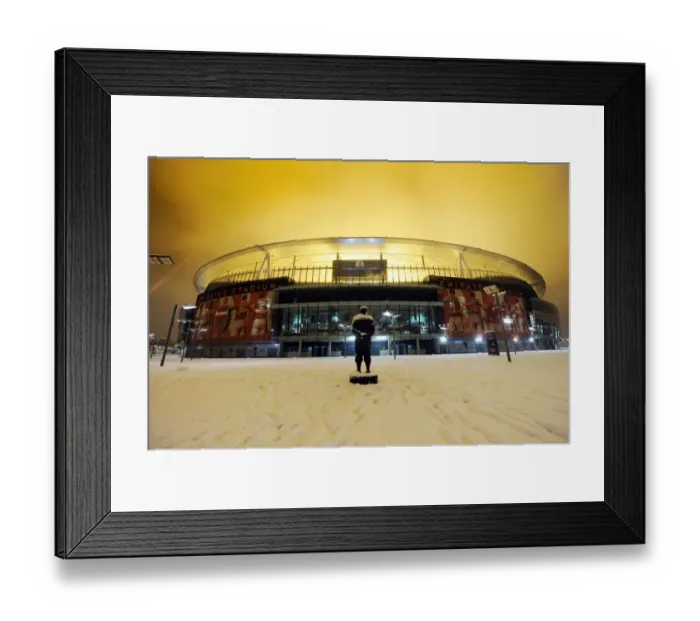 Framed Print : Winter's Grasp on Arsenal's Emirates Stadium: A Premier League Fortress Transformed into a Snowy Battlefield Framed Print : Winter's Grasp on Arsenal's Emirates Stadium: A Premier League Fortress Transformed into a Snowy Battlefield