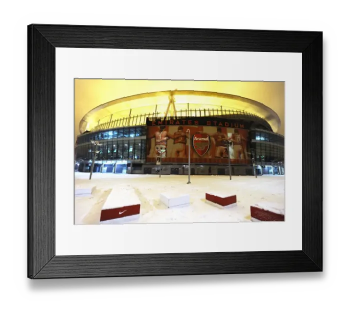 Framed Print : Winter's Battle at Emirates: Arsenal vs. Blackburn Rovers in a Snowy Premier League