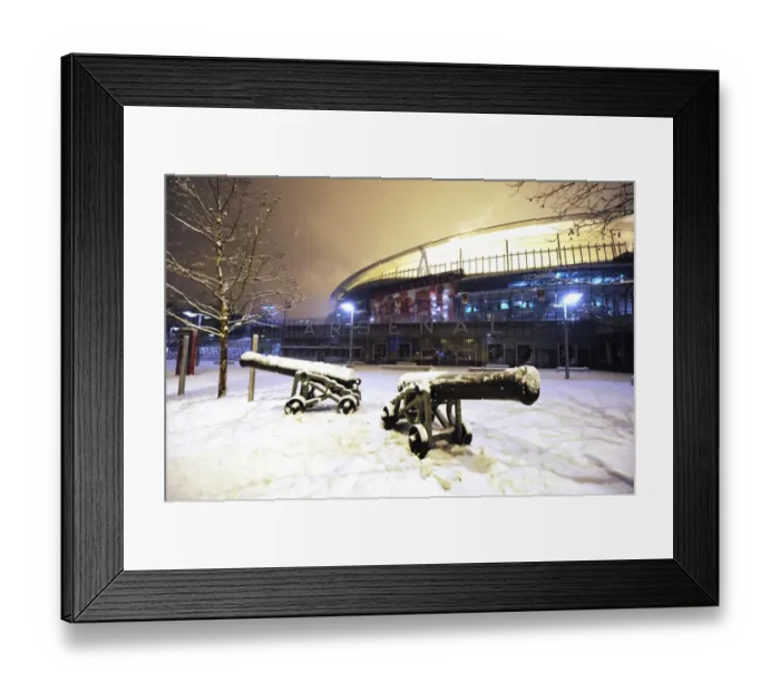 Framed Print : Winter's Battle: Arsenal's Emirates Stadium Transformed in Snow vs. Blackburn Rovers