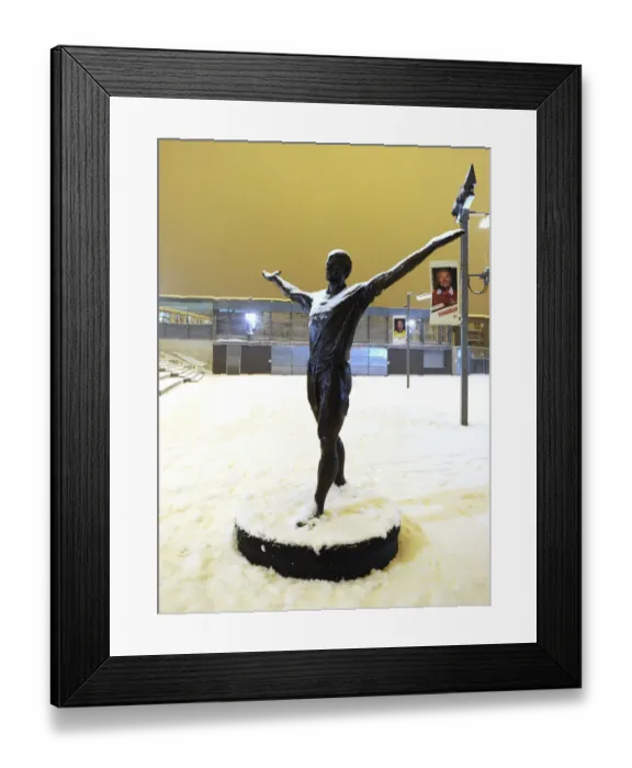 Framed Print : Snowy Emirates Stadium: Arsenal's Winter Battle in the Heart of Premier League Action