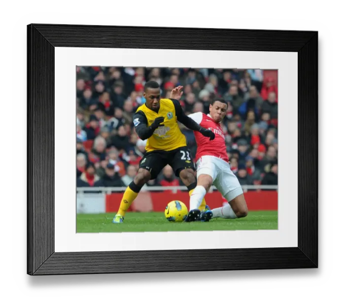 Framed Print : Coquelin vs. Hoilett: A Premier League Tackle Battle at Emirates Stadium