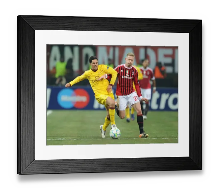 Framed Print : Mikel Arteta vs Ignazio Abate: Intense Clash in AC Milan vs Arsenal UEFA Champions League Match Framed Print : Mikel Arteta vs Ignazio Abate: Intense Clash in AC Milan vs Arsenal UEFA Champions League Match