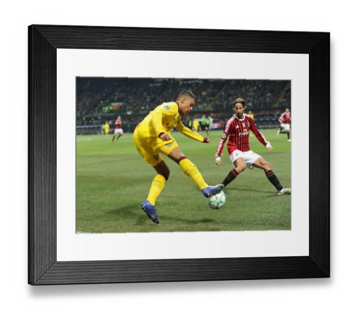 Framed Print : Clash of Titans: Oxlade-Chamberlain vs. Antonini in the UEFA Champions League