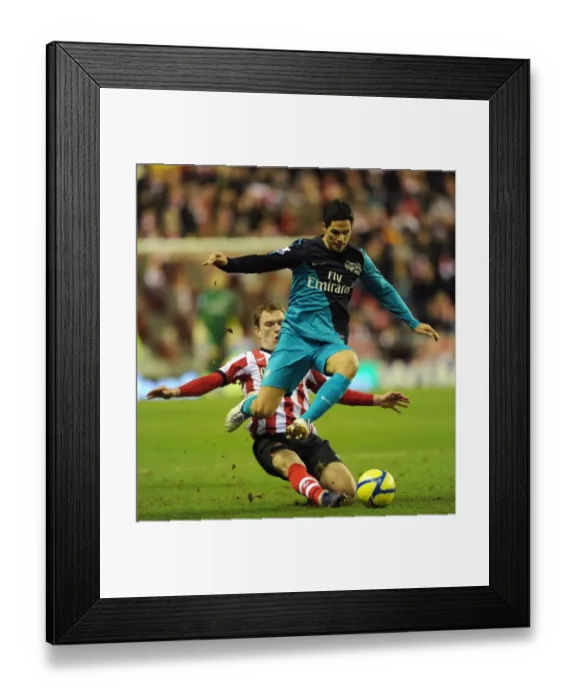 Framed Print : Mikel Arteta Leaps Past Craig Gardner: Sunderland vs. Arsenal, FA Cup 2011-12 Framed Print : Mikel Arteta Leaps Past Craig Gardner: Sunderland vs. Arsenal, FA Cup 2011-12