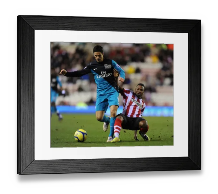 Framed Print : Mikel Arteta vs. Stephane Sessegnon: A FA Cup Showdown at Sunderland's Stadium of Light, 2012 Framed Print : Mikel Arteta vs. Stephane Sessegnon: A FA Cup Showdown at Sunderland's Stadium of Light, 2012