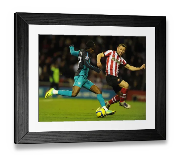 Framed Print : Gervinho vs. Bardsley: Intense Battle in Sunderland v Arsenal FA Cup Clash Framed Print : Gervinho vs. Bardsley: Intense Battle in Sunderland v Arsenal FA Cup Clash