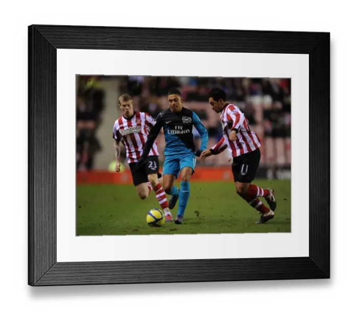 Framed Print : Alex Oxlade-Chamberlain Outmaneuvers Kieran Richardson in FA Cup Fifth Round Clash Framed Print : Alex Oxlade-Chamberlain Outmaneuvers Kieran Richardson in FA Cup Fifth Round Clash