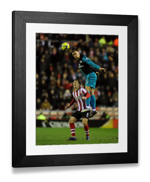 Framed Print : Thomas Vermaelen Leaps Over Craig Gardner: Sunderland vs Arsenal, FA Cup 2012 Framed Print : Thomas Vermaelen Leaps Over Craig Gardner: Sunderland vs Arsenal, FA Cup 2012