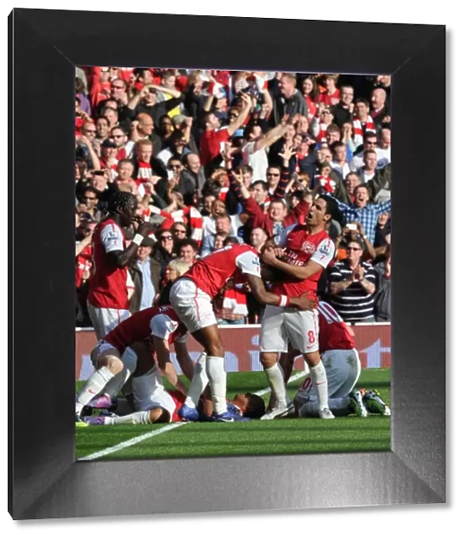 Arsenal's Five-Goal Blitz: Mikel Arteta and Alex Song Celebrate Theo Walcott's Goal vs. Tottenham (2011-12)