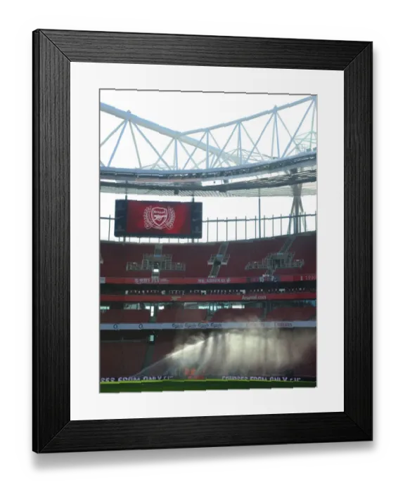 Framed Print : Preparing for the Derby: Arsenal Groundsman Tends to Emirates Stadium Pitch Framed Print : Preparing for the Derby: Arsenal Groundsman Tends to Emirates Stadium Pitch