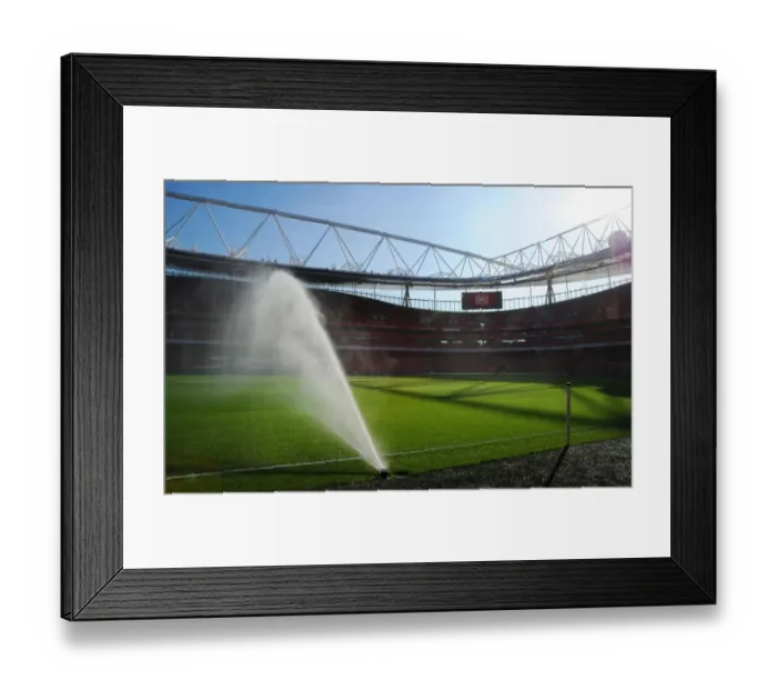 Framed Print : Preparing for the Derby: Arsenal Groundsman Tends to Emirates Stadium Pitch Framed Print : Preparing for the Derby: Arsenal Groundsman Tends to Emirates Stadium Pitch