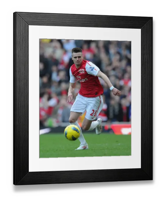 Framed Print : LONDON, ENGLAND - FEBRUARY 26: Carl Jenkinson of Arsenal during the Barclays Premier League match between Arsenal and Tottenham Hotspur at Emirates Stadium on February 26, 2012 in London, England. (Photo by Stuart MacFarlane  /  Arsenal FC via