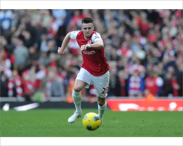 Jenkinson in Action: Arsenal vs. Tottenham Rivalry at Emirates Stadium