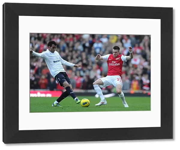 Arsenal vs. Tottenham: Jenkinson Tackles Sandro in Intense Premier League Clash