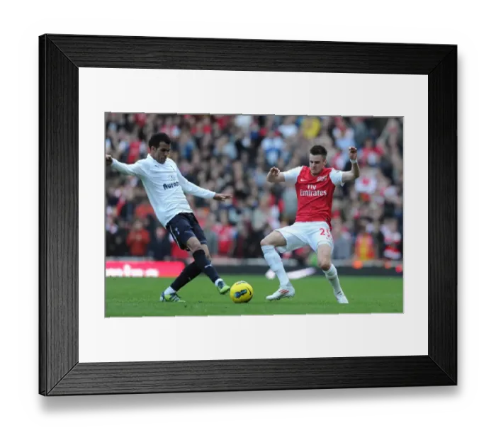 Framed Print : Arsenal vs. Tottenham: Jenkinson Tackles Sandro in Intense Premier League Clash