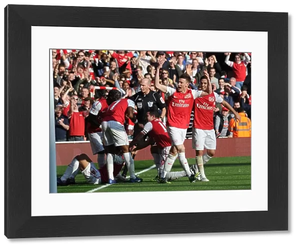 Arsenal's Five-Goal Blitz: Koscielny and Arteta Celebrate Walcott's Goal vs. Tottenham (2011-12)