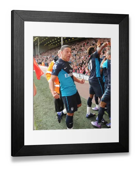 Framed Print : Arsenal's Unforgettable Victory: Van Persie's Double Strike vs. Liverpool (2012) - Oxlade-Chamberlain's Emotional Celebration