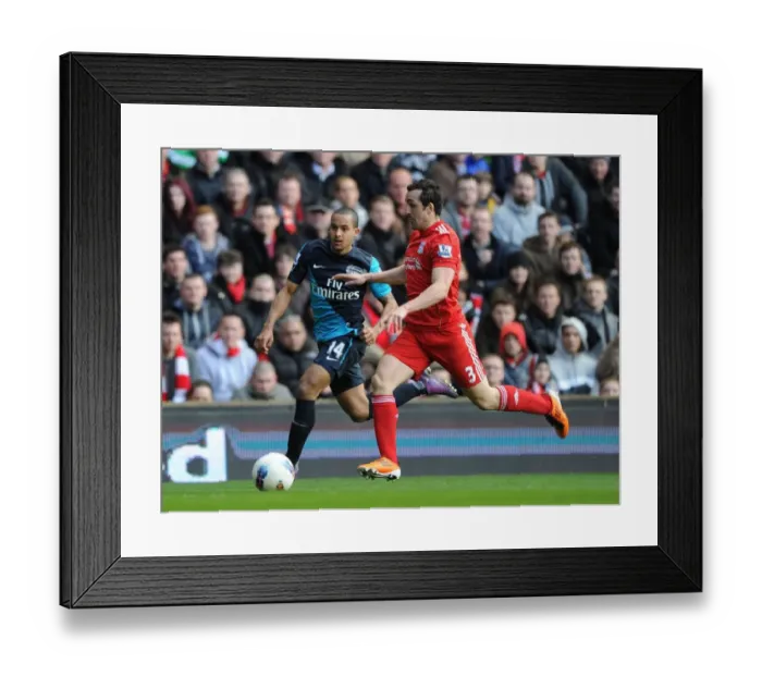 Framed Print : Theo Walcott vs Jose Enrique: Intense Battle at Anfield (Liverpool v Arsenal, Premier League 2011-12)