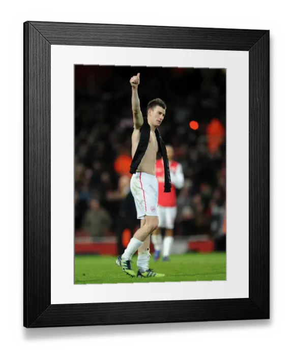 Framed Print : Arsenal's Historic 3-0 Victory Over AC Milan: Laurent Koscielny Celebrates with Fans in the Emirates Stadium Framed Print : Arsenal's Historic 3-0 Victory Over AC Milan: Laurent Koscielny Celebrates with Fans in the Emirates Stadium