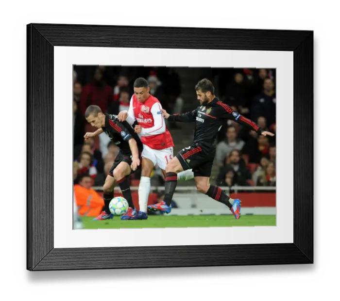 Framed Print : Arsenal's Oxlade-Chamberlain Fouled as Arsenal Crush AC Milan 3-0 in UEFA Champions League Framed Print : Arsenal's Oxlade-Chamberlain Fouled as Arsenal Crush AC Milan 3-0 in UEFA Champions League