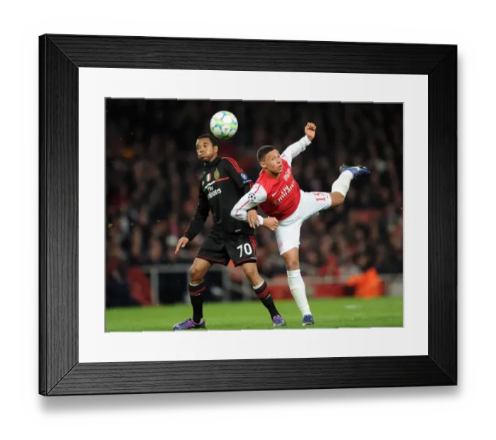 Framed Print : Arsenal's Dominant Display: 3-0 Over AC Milan in Champions League Round of 16 (Alex Oxlade-Chamberlain, Robinho) Framed Print : Arsenal's Dominant Display: 3-0 Over AC Milan in Champions League Round of 16 (Alex Oxlade-Chamberlain, Robinho)