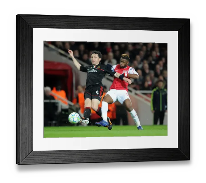 Framed Print : Arsenal's Triumph: 3-0 Over AC Milan - The Unforgettable Clash Between Alex Song and Mark van Bommel in the UEFA Champions League