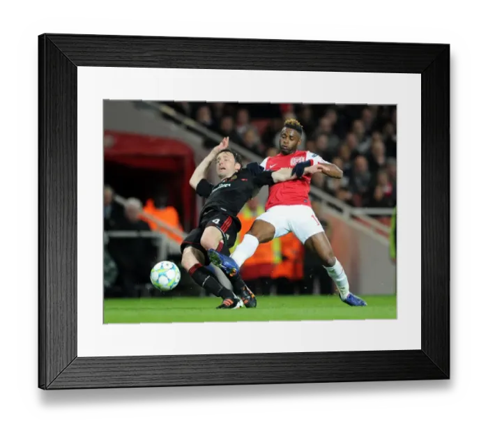 Framed Print : Arsenal's Dominant Performance: 3-0 Over AC Milan in Champions League Round of 16 (Alex Song vs Mark van Bommel)