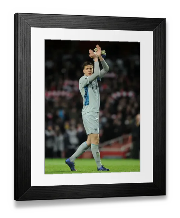 Framed Print : Arsenal's Glorious Victory: Wojciech Szczesny Celebrates with Fans after 3-0 Win over AC Milan in UEFA Champions League Framed Print : Arsenal's Glorious Victory: Wojciech Szczesny Celebrates with Fans after 3-0 Win over AC Milan in UEFA Champions League