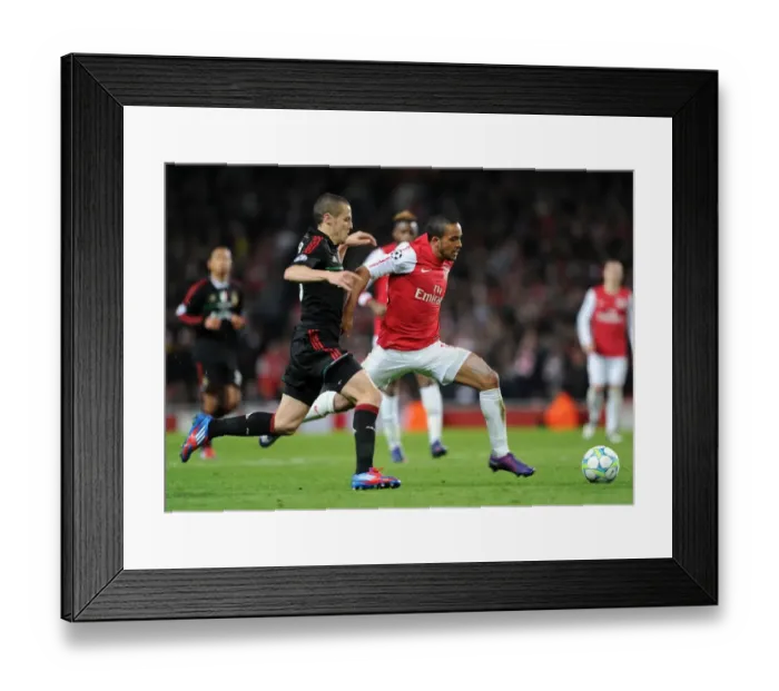 Framed Print : Theo Walcott's Brilliant Performance: Arsenal Crushes AC Milan 3-0 in UEFA Champions League