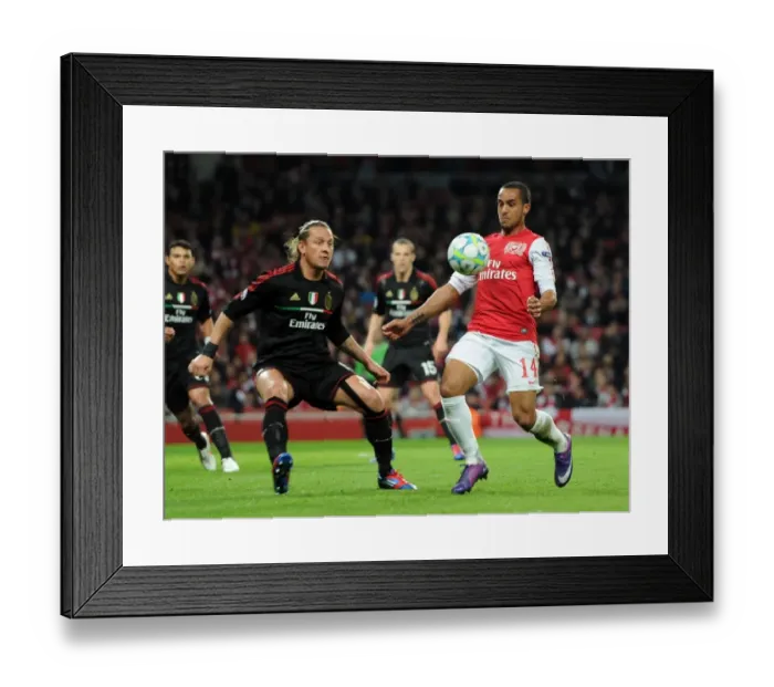 Framed Print : Theo Walcott's Unforgettable Night: Arsenal's 3-0 Victory over AC Milan in the UEFA Champions League Framed Print : Theo Walcott's Unforgettable Night: Arsenal's 3-0 Victory over AC Milan in the UEFA Champions League