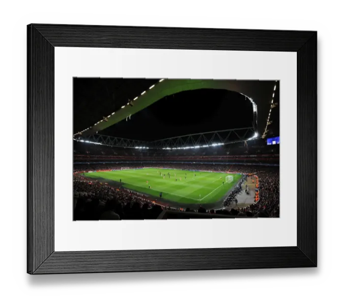 Framed Print : Arsenal FC vs AC Milan: Champions League Showdown at Emirates Stadium