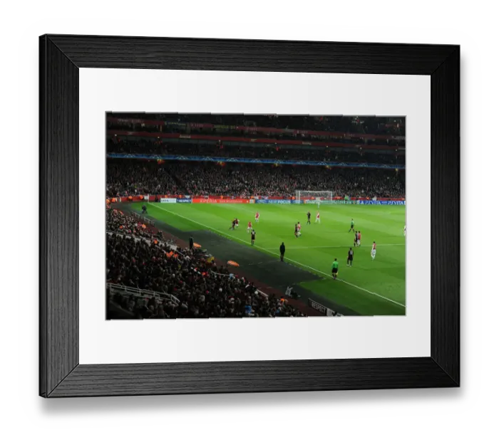 Framed Print : Arsenal's Emirates Stadium Ablaze with Champions League Tension: Arsenal FC vs AC Milan