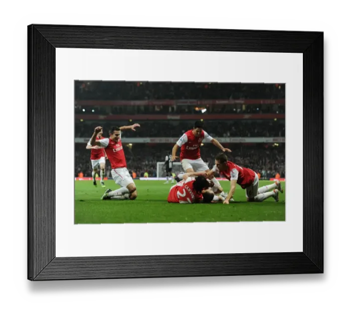 Framed Print : Arsenal's Vermaelen Scores the Second Goal vs. Newcastle United (2011-12) Framed Print : Arsenal's Vermaelen Scores the Second Goal vs. Newcastle United (2011-12)